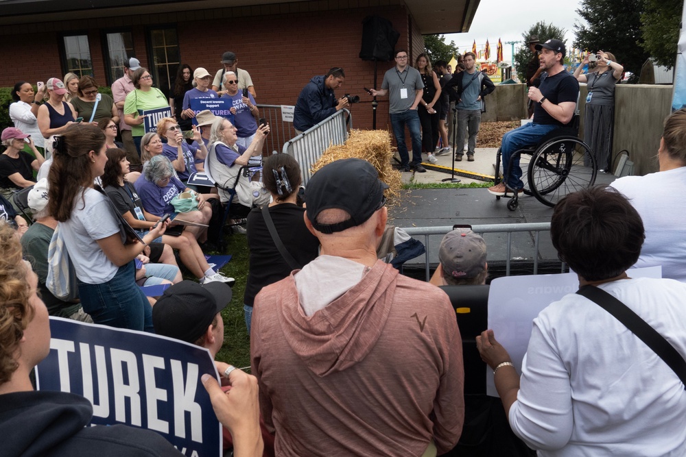 Democratic nominee for the U.S. Senate Josh Turek speaks to fairgoers at the Iowa State Fair - a blue win in a red state would be a big statement for the Demcorats (Getty)