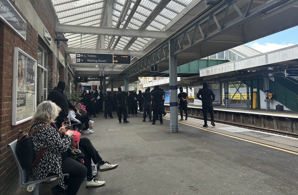 Masked men could be seen at Dover Priory station at around midday boarding a train. (Oscar Rihill/PA) (PA Wire)
