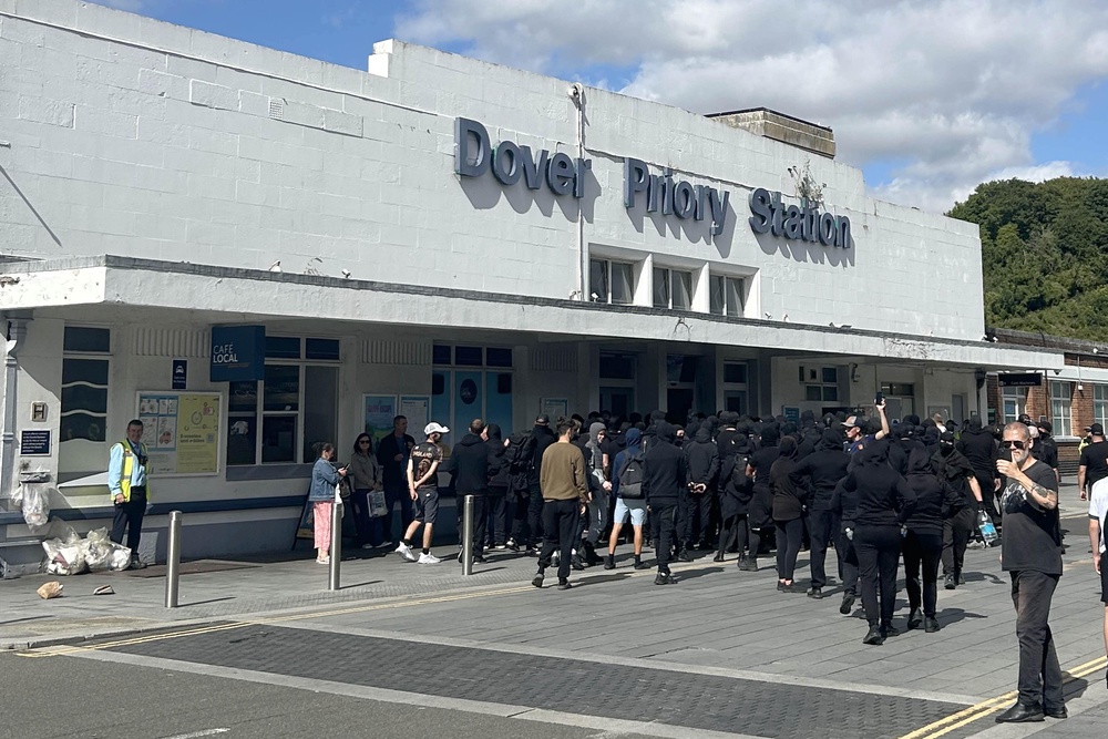 Protesters at Dover Priory train station after black-clad and masked anti-illegal migrant demonstrators blocked roads in the port (PA Wire)