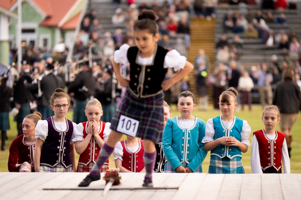 Children watch as a girl competes in the sword dance event (Aaron Chown/PA) (PA Wire)