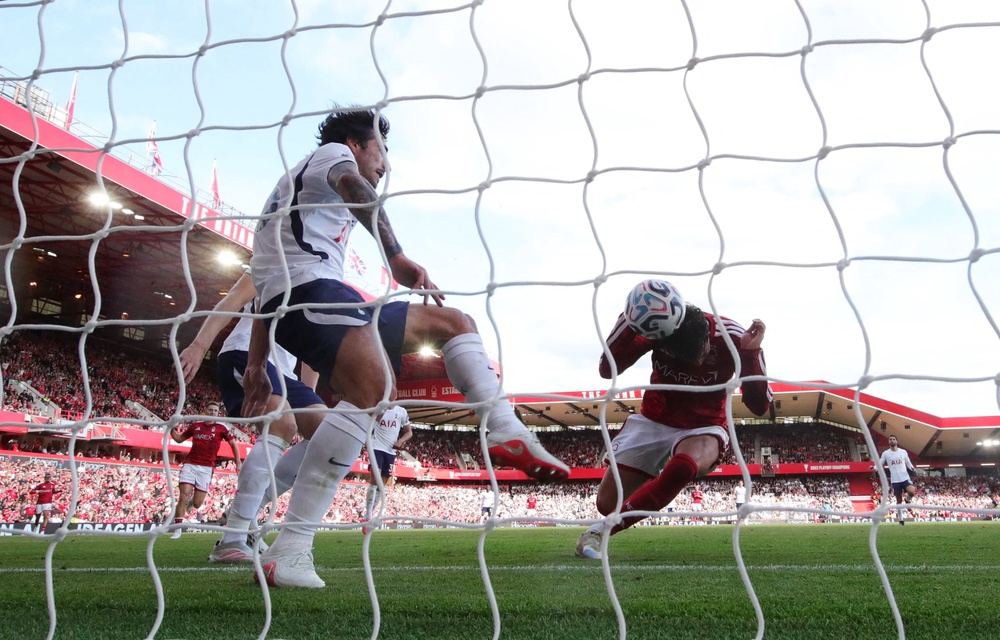 Williams threw himself into the header as Tonali attempted to clear off the line (Reuters)