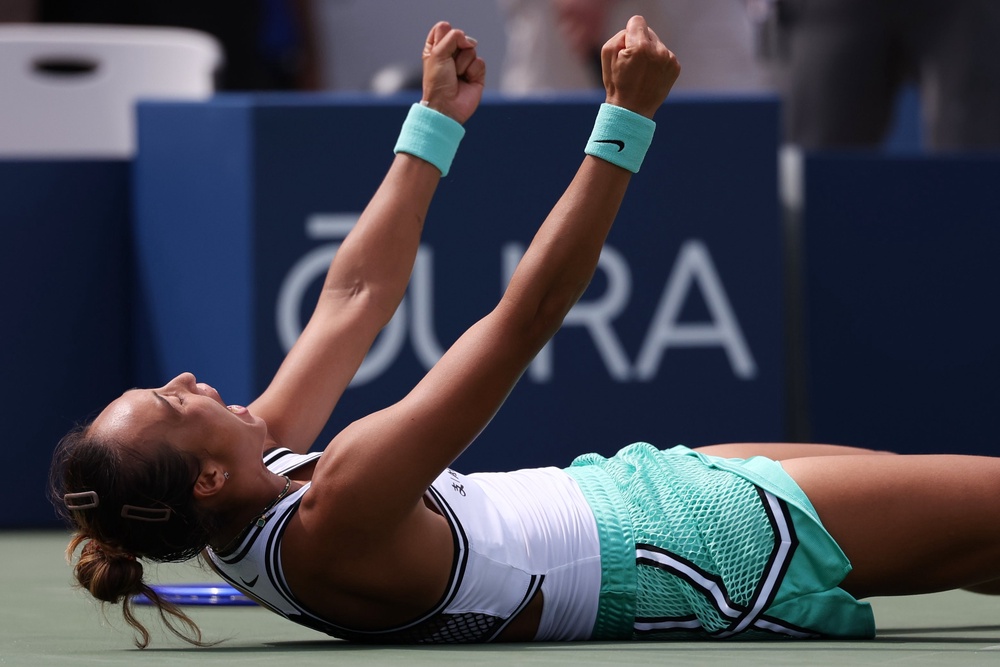 Zheng dropped to the court in joy as she overcame Keys (AP)