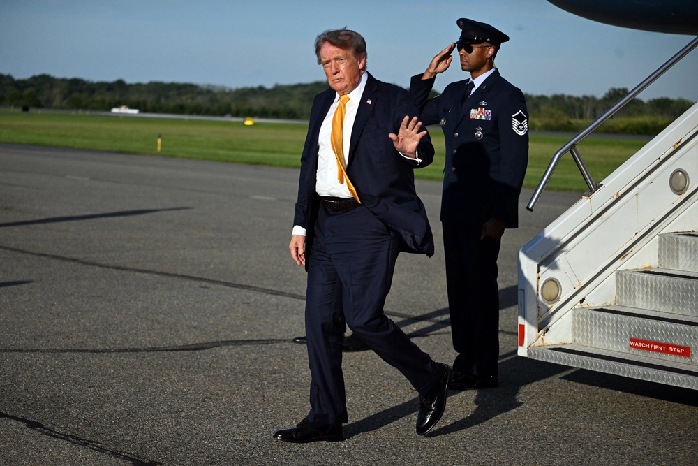 The president’s apparent new hairdo saw him compared to former James Bond actor Pierce Brosnan (AFP via Getty Images)