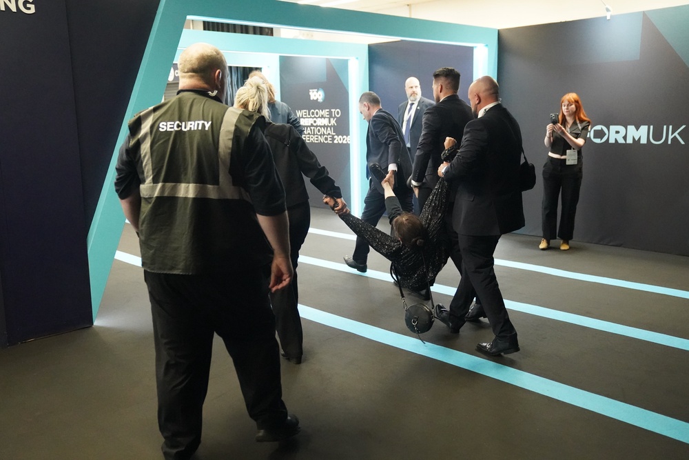 Video emerged of a woman having her hair pulled by audience members at Reform UK’s conference (PA Wire)