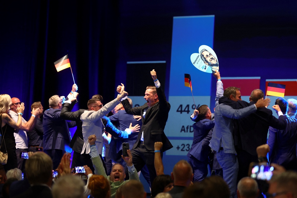 AfD supporters celebrate after polls closed in the Saxony-Anhalt state elections, in Magdeburg, Germany (Reuters)