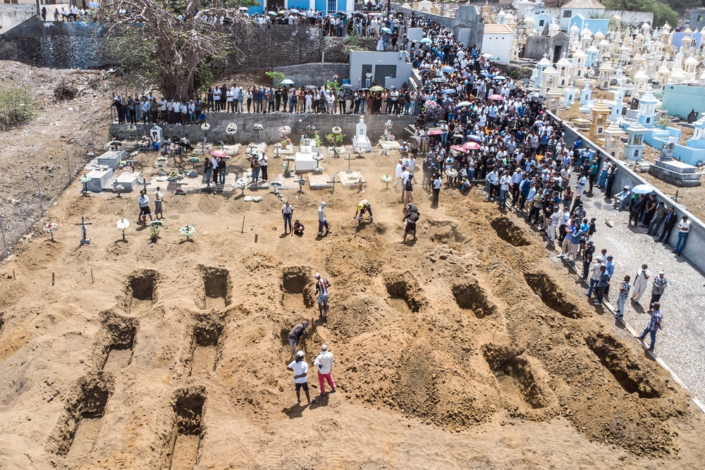 An aerial view of residents and relatives of the victims killed in a bus crash gathering during their funeral (AFP/Getty)