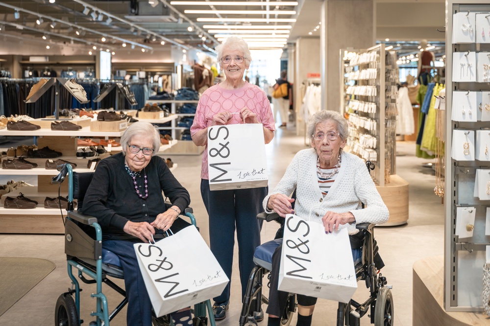 Tor-na-dee resisents Frances Blair, Katherine Clarck, and May Bremnar with M and S shopping bags