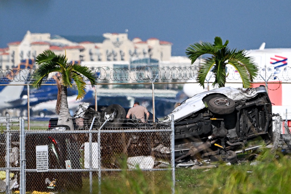 On a Kick livestream to his 39,200 followers, ChickenAndy filmed his group of four approaching the crashed plane and interacting with media, civilians and police (AFP/Getty)