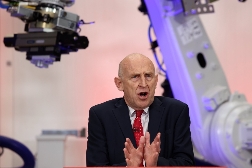 Britain's Chancellor of the Exchequer, John Healey delivers a speech at the Manufacturing Technology Centre in Coventry (AP)