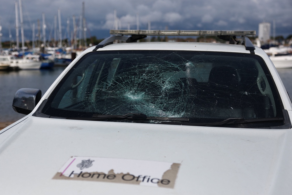 A damaged Home Office vehicle near Eastney Ferry Landing, following anti-immigration protests (Reuters)