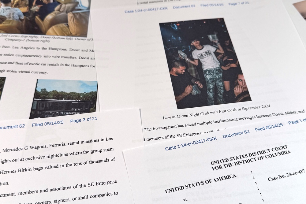This Justice Department court filing in the case against Hamza Doost and Kunal Mehta, that includes a photo of Malone Lam, is photographed Friday, Sept. 4, 2026. (AP Photo/Jon Elswick) (Copyright 2026 The Associated Press. All rights reserved.)
