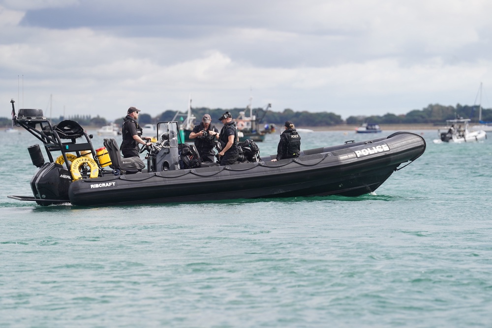 Police officers patrol on a Rib (rigid inflatable boat) off the coast of Eastney Beach in Portsmouth (Joe Sene/PA) (PA Wire)