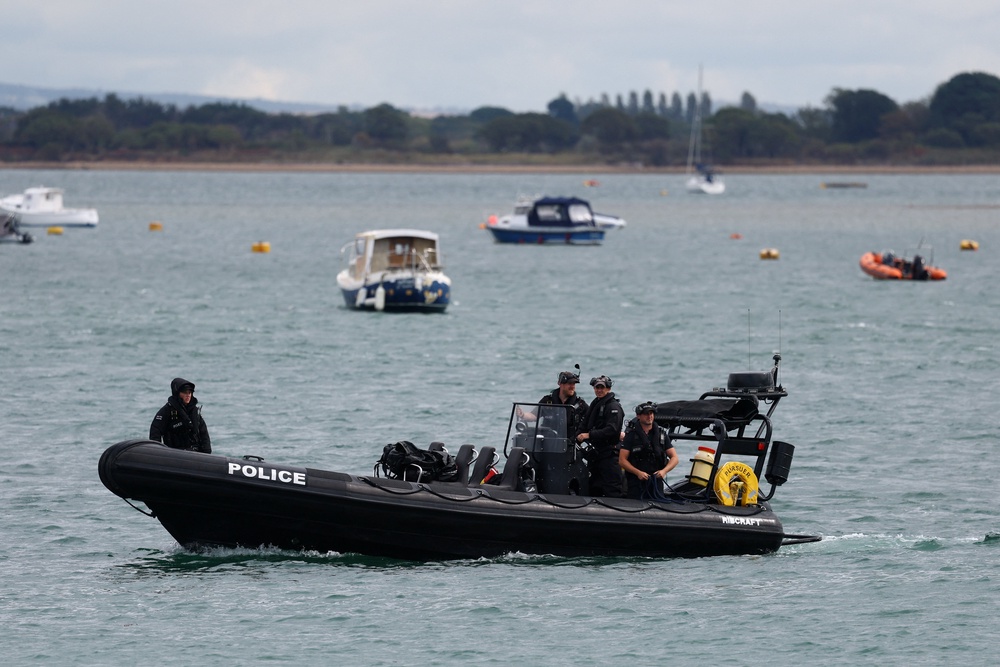 Police officers patrol on a boat near Eastney Ferry Landing, following anti-immigration protests, in Portsmouth (Reuters)