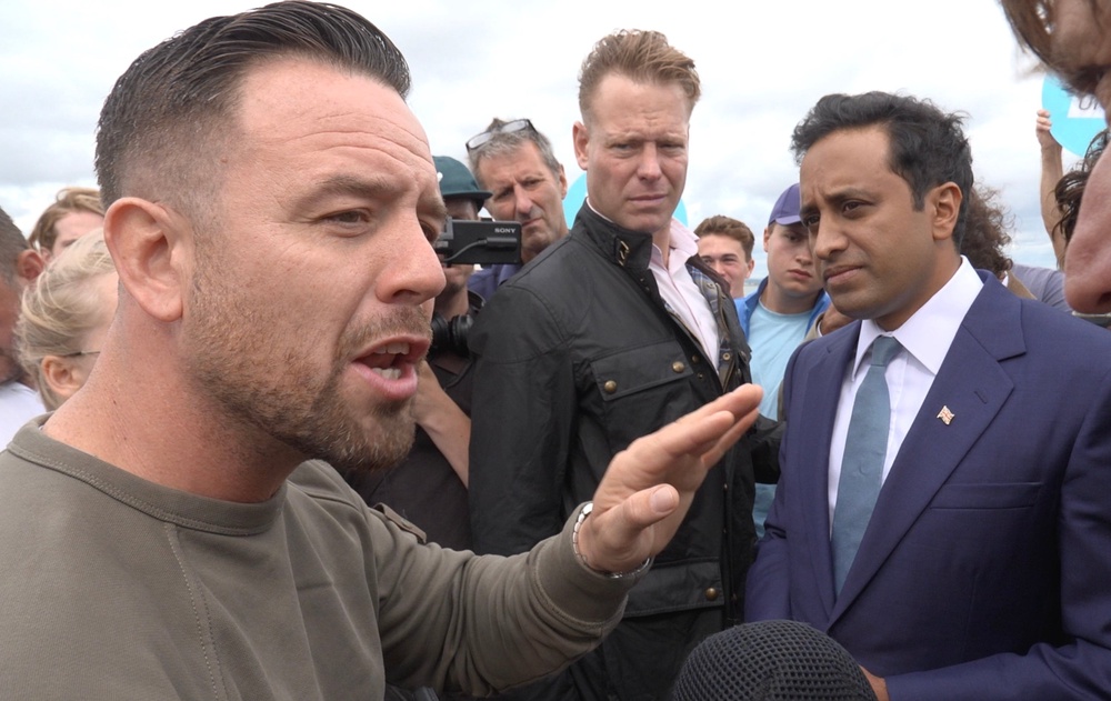 Patriot Platform founder Daniel Thomas confronted Reform UK’s Zia Yusuf, telling him his party leader Nigel Farage needs to be ‘careful with his words’ (PA)