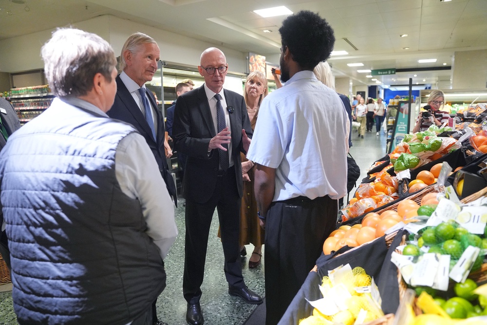 Work and Pensions Secretary Pat McFadden (centre) during a visit to John Lewis in London’s Oxford Street (PA)