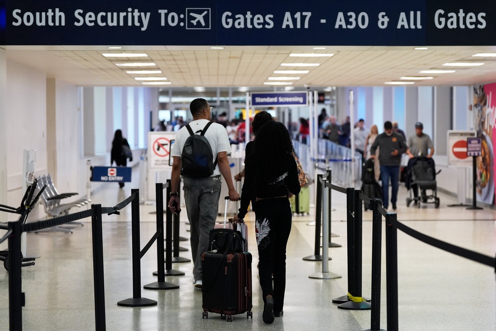Travelers walk through TSA security lines at George Bush Intercontinental Airport (Copyright 2026 The Associated Press. All rights reserved)