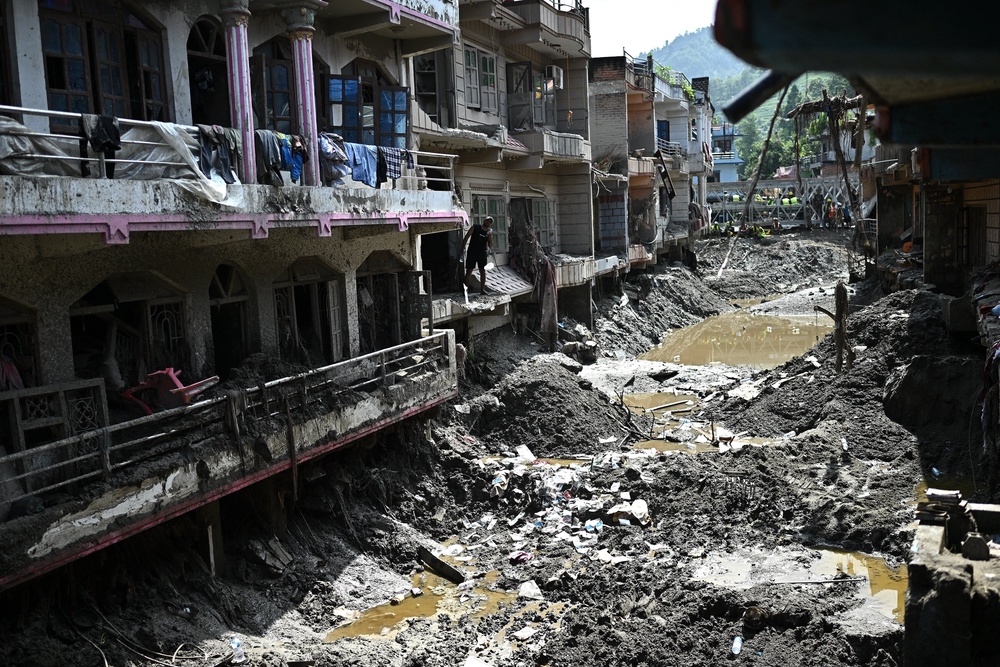 A man looks at the remains of houses in the aftermath of flash floods at Devighat in Nepal's Nuwakot district on 8 September 2026 (AFP/Getty)