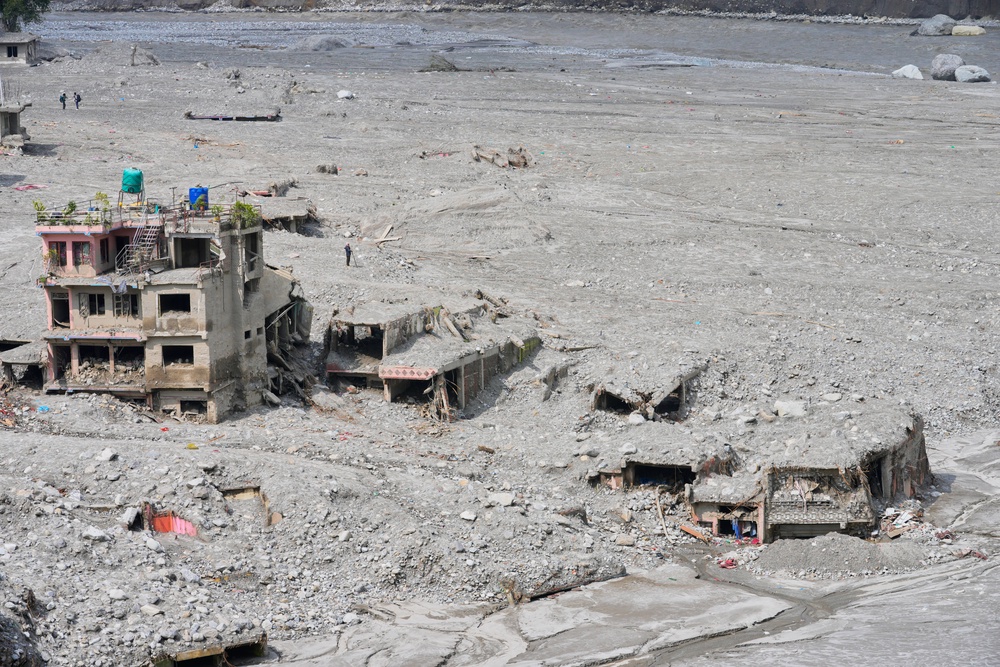 Houses damaged by the flash floods now stand in thick layers of sludge, mud and debris (Dar Yasin/AP) (AP)