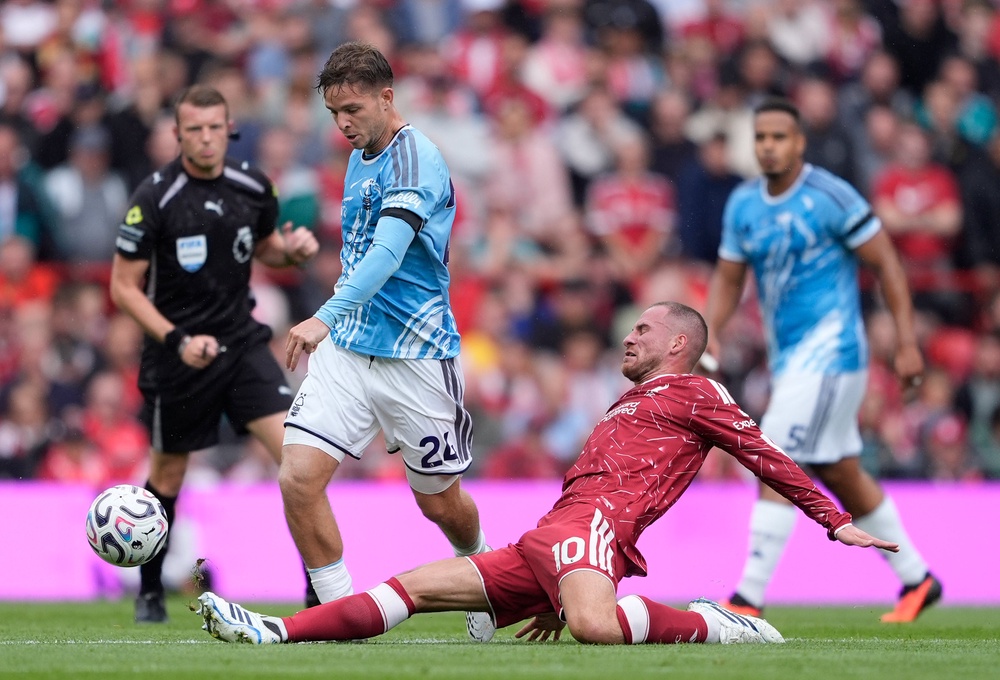 Alexis Mac Allister puts in a sliding tackle on Nottingham Forest midfielder James McAtee (PA)