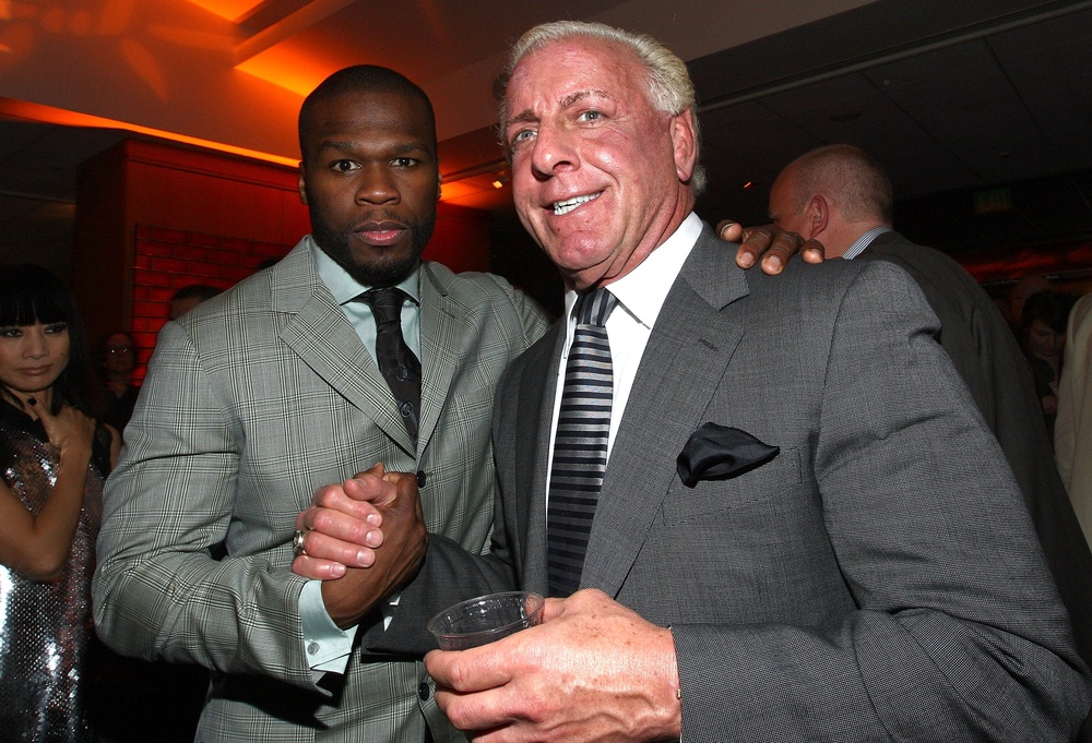 Ric Flair, seen here with rap superstar 50 Cent, claims he was tricked by an online talent agency and is now seeking at least $10 million (Getty Images)