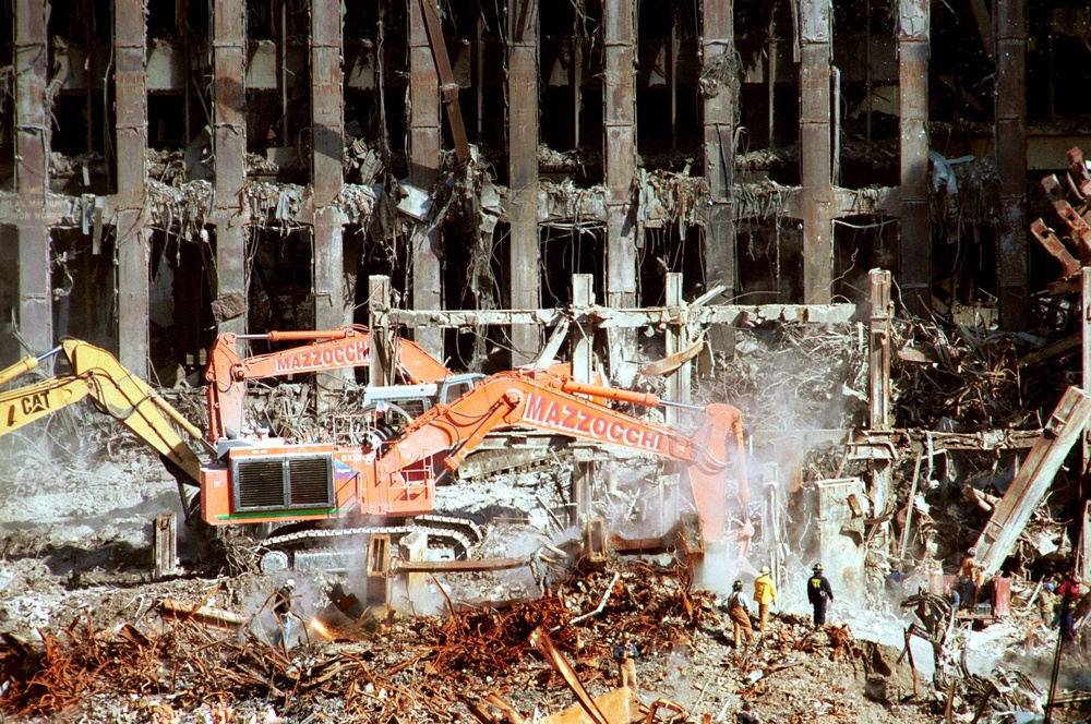 First responders and construction workers search Ground Zero in New York City on October 17, 2001, for the remains of victims killed in the 9/11 terror attacks (Getty)