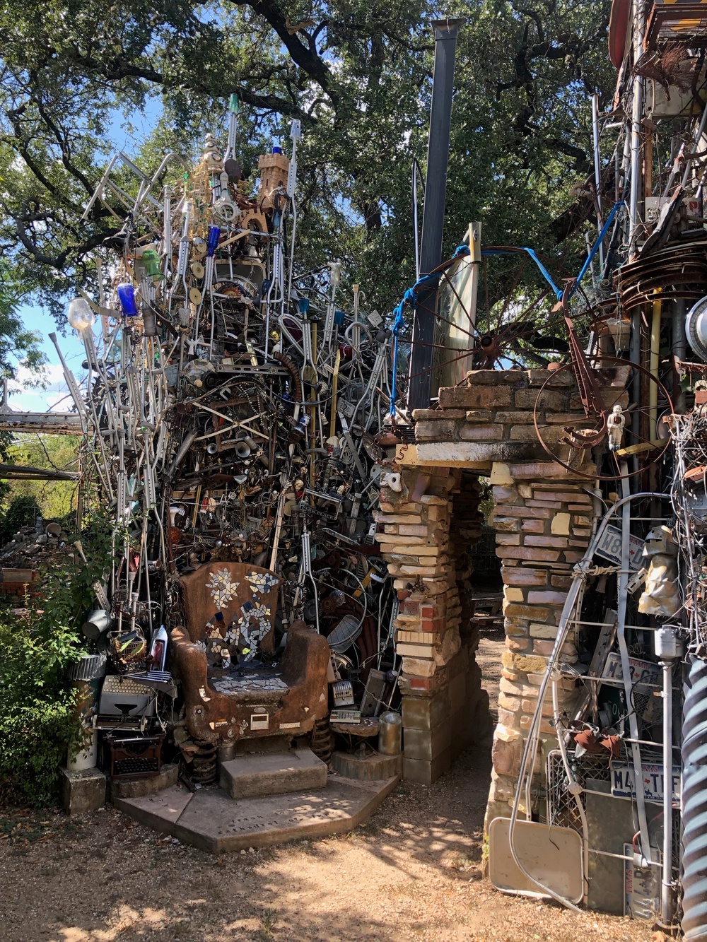 Visitors post pictures of themselves outside the installation, next to a 'Welcome To Fabulous Trash Vegas' sign or sitting on a throne made of upside-down crutches (Vince Hannemann)