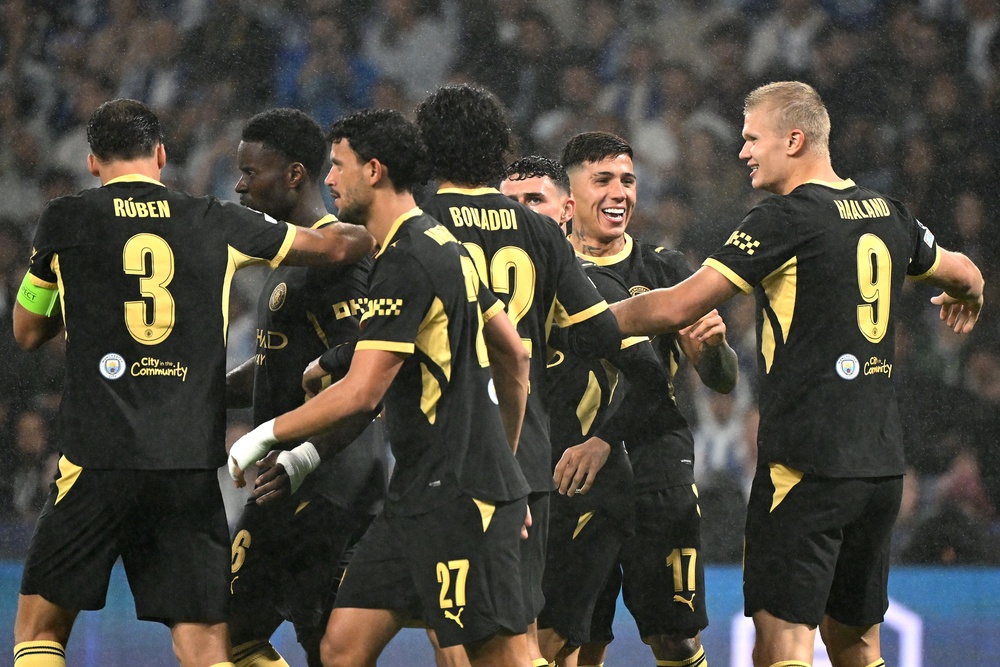 Erling Haaland, right, celebrates his first goal with Manchester City teammates (PA Wire)
