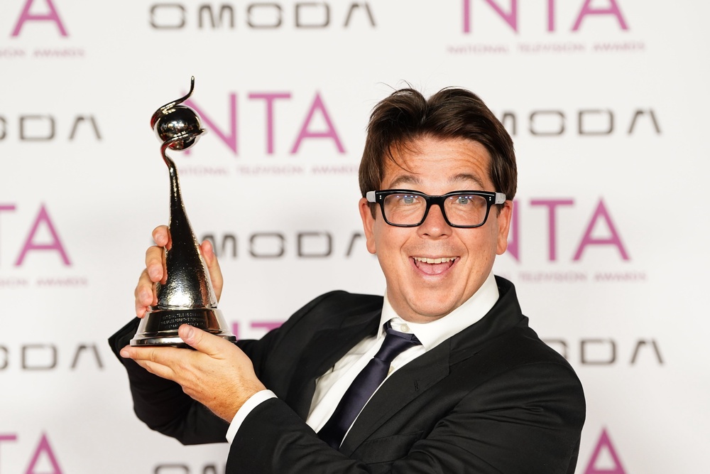 Michael McIntyre poses with his award (Ian West/PA) (PA Wire)