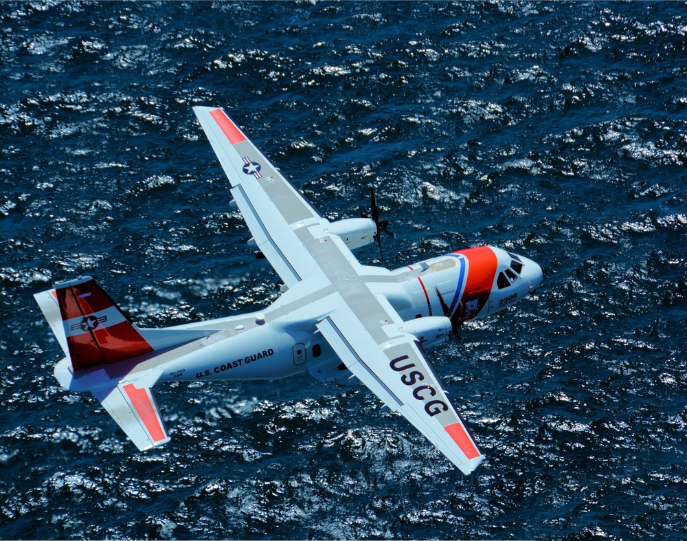 A Coast Guard plane flying over the waters near Andros Island in The Bahamas (USCG)