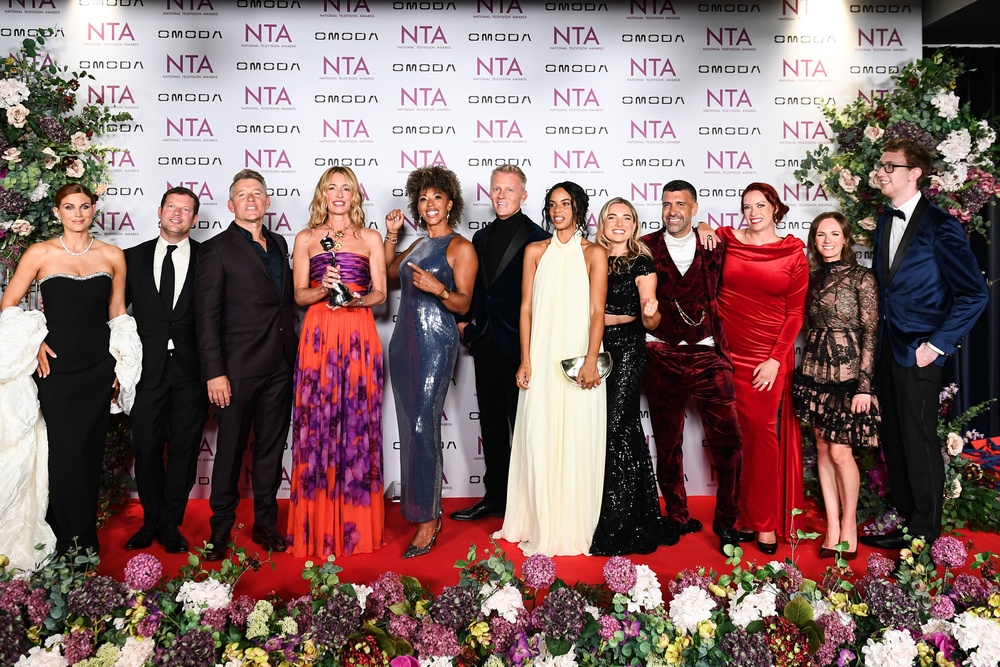 Ashley James, Dermot O'Leary, Ben Shephard, Cat Deeley, Dr Zoe Williams, Dr Scott Miller, Rochelle Humes, Sian Welby, Dan Hatfield, Sharon Marshall, Grace Forrell and Jordon Cox pose with the 'Daytime' award in the Winners Room at the National Television Awards 2026 (Getty)