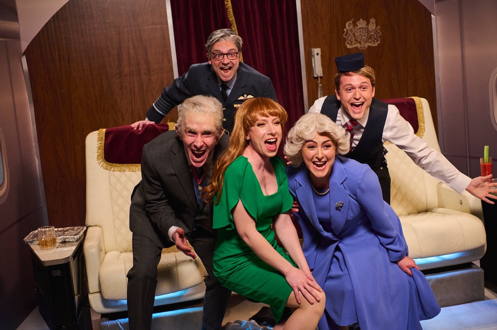 Larry Dean as King Charles, George Fouracres as Keir Starmer, Celeste Dring as Angela Rayner, Emma Sidi as Queen Camilla and Jack Shep as a flight attendant in a sketch (Sky UK)