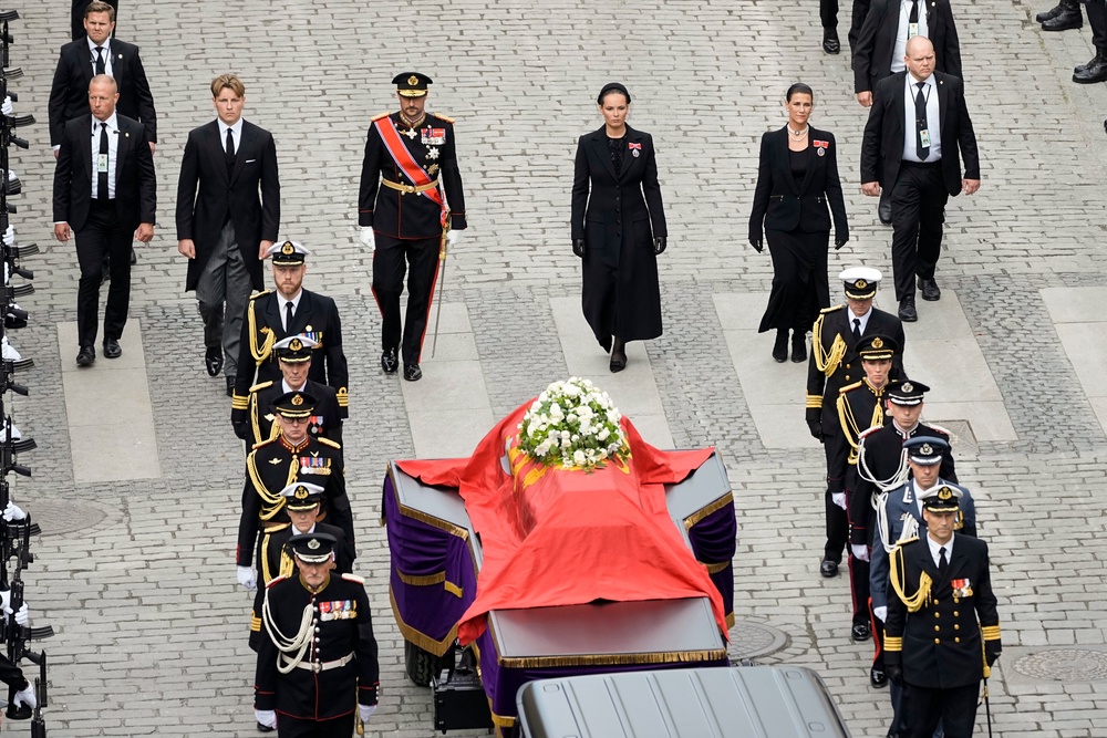 Norway’s Prince Sverre Magnus, King Haakon VIII, Crown Princess Ingrid Alexandra and Princess Martha Louise walk behind the coffin of King Harald V (Cornelius Poppe/AP)