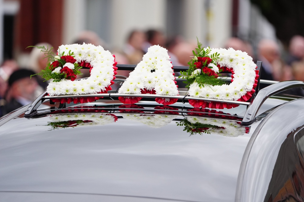 A floral tribute which says 'Dad' on top of the hearse at the funeral of PC Matthew Blades. (PA)
