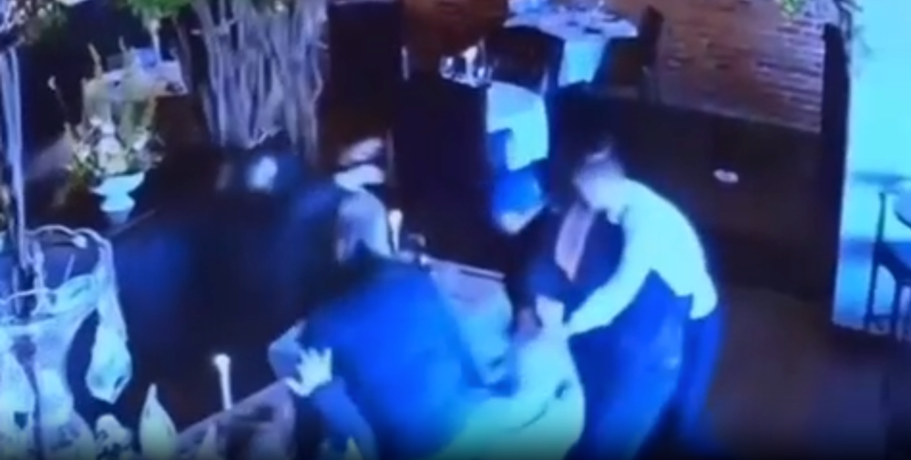 Surveillance footage shows the waiter and restaurant patrons rushing to tackle Matthew Exton to the ground after he pulled the gun on his ex-wife (Lucas County Prosecutor)