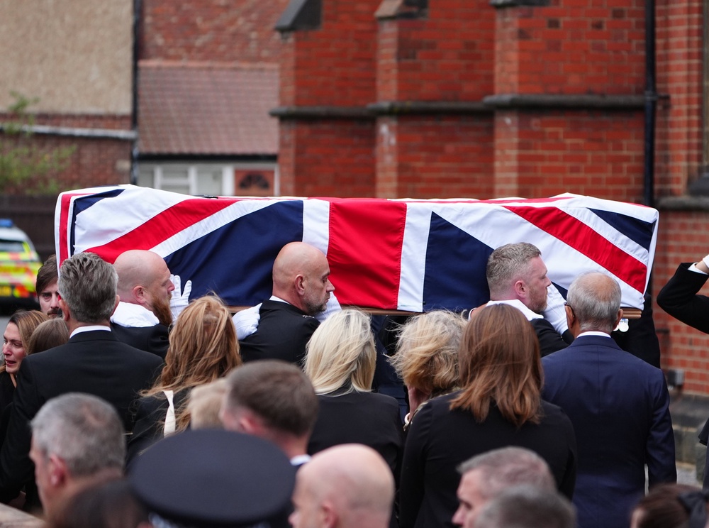 Pall bearers carry the coffin of Pc Matthew Blades into his funeral at St Joseph’s Roman Catholic Church in Hartlepool (Owen Humphreys/PA) (PA Wire)