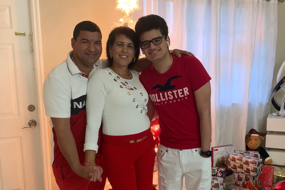 This undated photo provided by the family of Yoel Rodriguez Naranjo show him with his wife and son