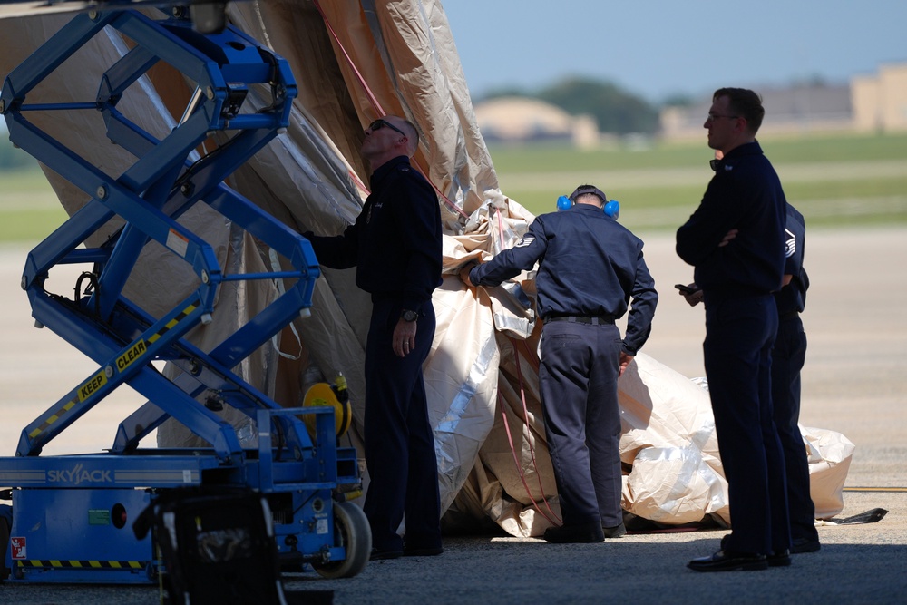 The president told reporters that ‘they were doing a check on the slide,’ which he said ‘takes about 15 minutes’ (AP)