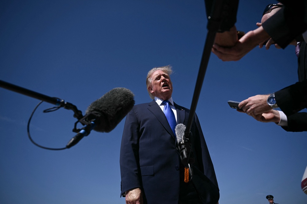 Trump speaks to reporters before boarding Air Force One at Joint Base Andrews in Maryland on September 9 (AFP/Getty)