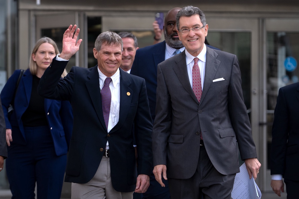 Hearn, left, and lawyer Norm Eisen, right, are anticipating a judge in DC to block prosecutors from ever charging Hearn again in connection with damage to the pool (AP)