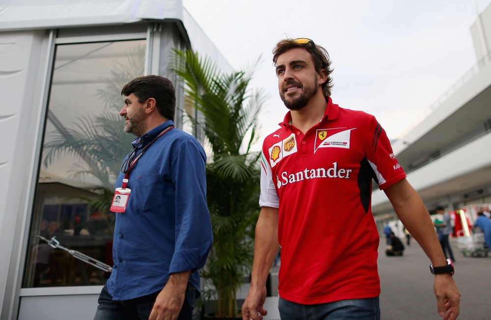 Luis Garcia Abad (left) is the long term agent of Fernando Alonso (Getty)