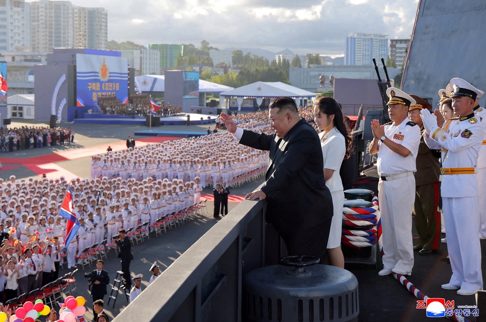 North Korean leader Kim Jong Un, accompanied by his daughter Kim Ju Ae, attends the commissioning ceremony of the destroyer Kang Kon, at Wonsan Port (Reuters)