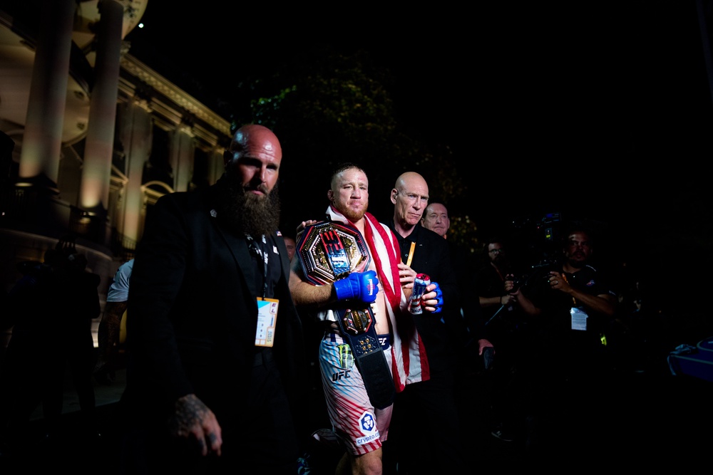 Gaethje (centre) finally realised his dream of becoming undisputed champion after two interim-title reigns (Getty)