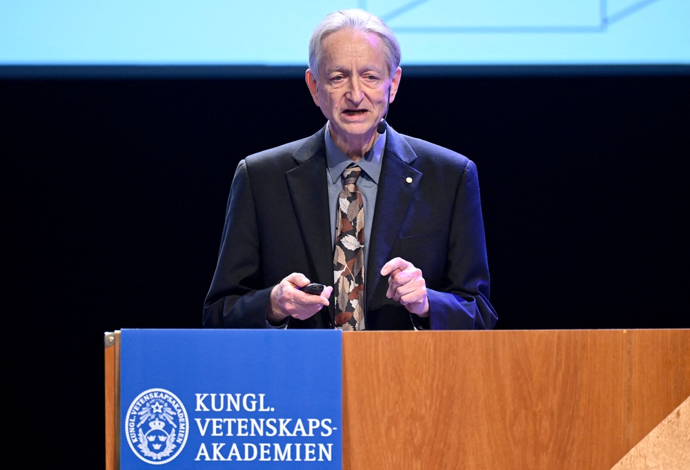 Retired computer scientist and ‘godfather of AI’ Geoffrey Hinton, seen here delivering his Nobel Prize lecture in Aula Magna, Sweden, on December 8, 2024, is among the major tech figures who have warned of the potential threats posed by AI (AFP/Getty)