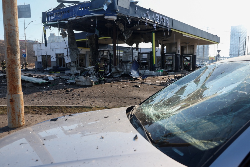 Firefighters work at the site of a gas station hit by a Russian drone strike, amid Russia's attack on Ukraine (Reuters)
