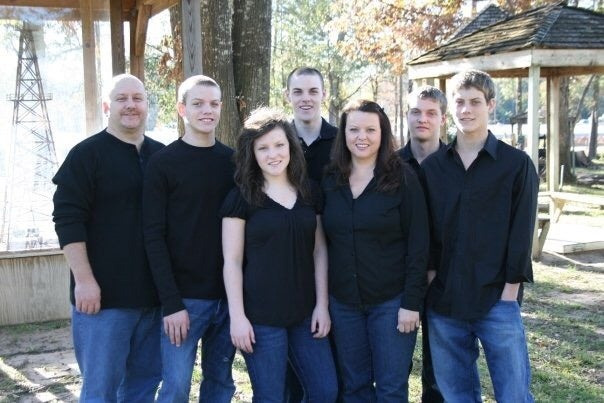 Rooney, pictured with his wife and five children in 2009, said he had convinced himself he could work his family out of debt (Brian Rooney)