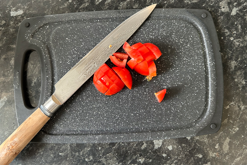 I used the knives on dense sweet potatoes, delicate tomatoes and more (Sarah Michael/The Independent)