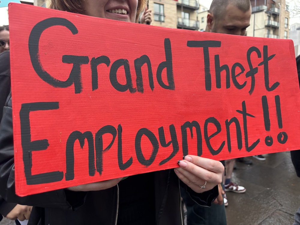 People take part in a rally outside Glasgow Tribunals Centre ahead of a hearing for a group of former Rockstar employees who are claiming unfair dismissal from the video games developer (Jane Barlow/PA) (PA Archive)