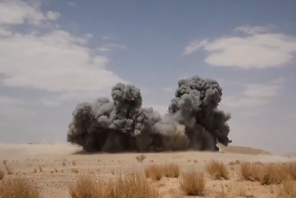 Smoke from a wide explosion following what the Houthis described as an attack on Saudi-backed forces in eastern Jawf province, Yemen, on 9 September (AP)