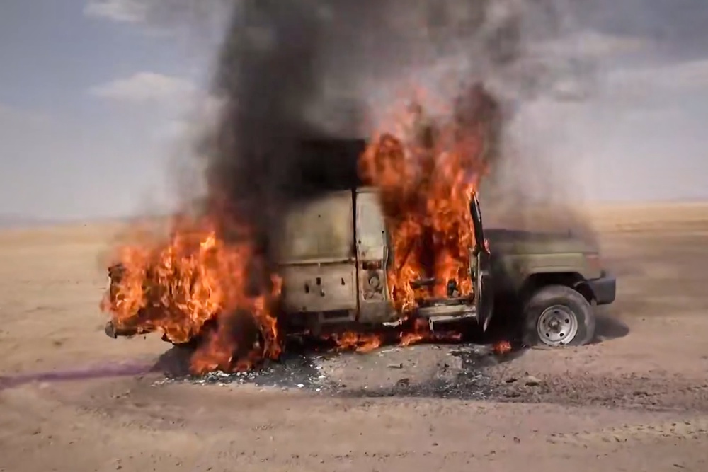 A pickup truck burning following what the Houthis described as an attack on Saudi-backed forces in eastern Jawf province, on 9 Sep (AP)