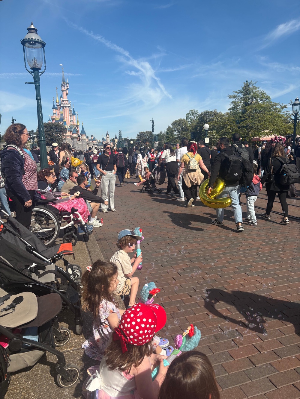 Our three, four-year-olds loved every second of their Disney experience, including waiting for the character parade (pictured) (Lizzie Edmonds)